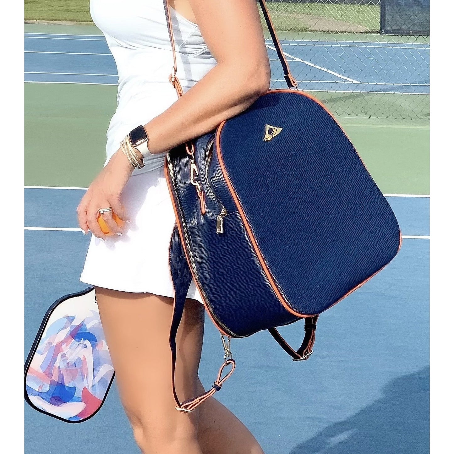 HANA water ripple pattern bag for tennis racquets;  paddles and travel;  free clutch and tassel;  gold hardware and full features for all sports.