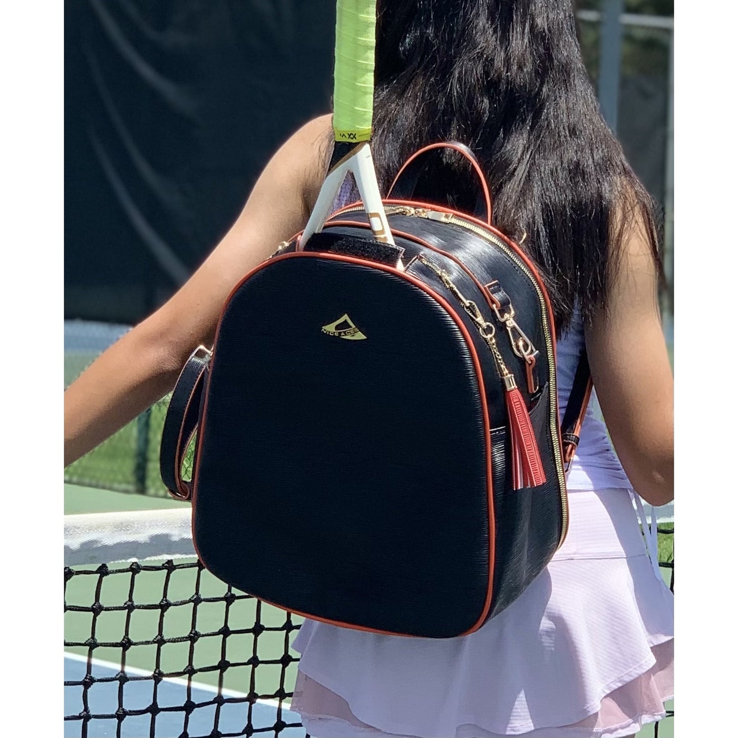 HANA water ripple pattern bag for tennis racquets;  paddles and travel;  free clutch and tassel;  gold hardware and full features for all sports.